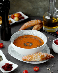 lentil soup in a white bowl sprinkled with ground pepper