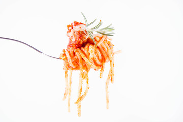 Spaghetti bolognese sprinkled with cheese and decorated with a rosemary twig on a fork on a white background