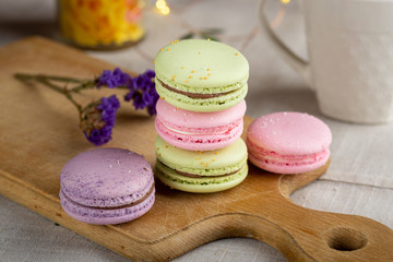 colorful macaroons on wooden table