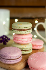colorful macaroons on a wooden table