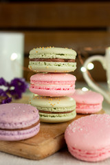 colorful macaroons on wooden table