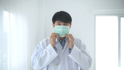 Fototapeta na wymiar Medical concepts. The doctor is wearing a mask in the hospital. 4k Resolution.