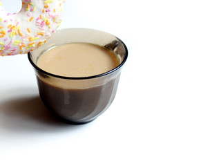 Donut with Pink and Yellow with icing and topping isolated on a White Background with coffee