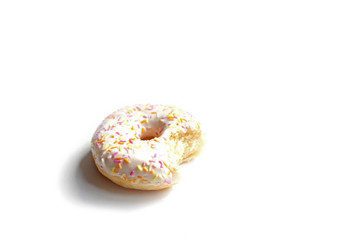Donut with Pink and Yellow with icing and topping isolated on a White Background