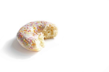 Donut with Pink and Yellow with icing and topping isolated on a White Background
