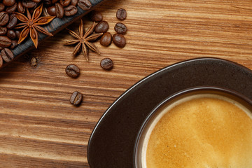 Coffee cup and coffee beans on a wooden background. Top view .
