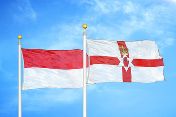 Indonesia and Northern Ireland two flags on flagpoles and blue cloudy sky