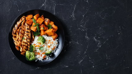 close-up of chicken strips, broccoli, rice, yams © myviewpoint