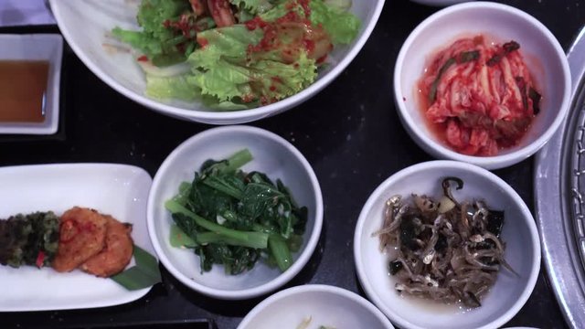 Korean food variety of BBQ side dishes kimchi and other things