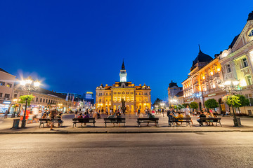 Fototapeta na wymiar Novi Sad, Serbia - July 19, 2019: Freedom Square (serbian: Trg slobode) is the main square in Novi Sad. The photo shows County government office (City house) and monument of Svetozar Miletic.