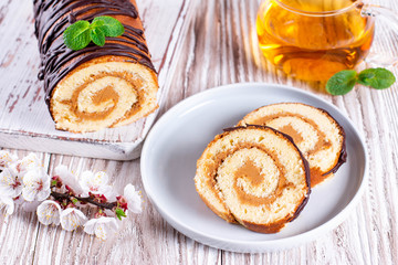 Sweet sponge roll stuffed with cream