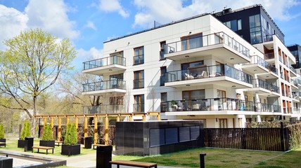 Multistory new modern apartment building. Stylish living block of flats.