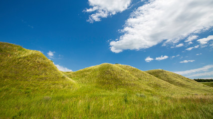 grass-covered hills above the valley on a sunny day
