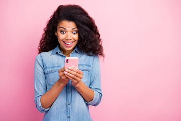 Portrait of crazy addicted afro american girl use smartphone read social media information get like...