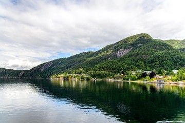 Idyllic view on Hardangerfjord by Jondal, Norway.