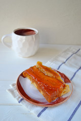 Caramel banana pie on a white background