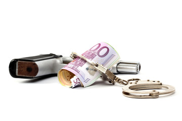 Money and handcuffs. Concept for corruption, fraud, money laundry