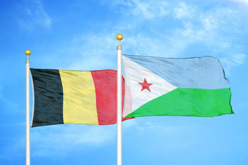 Belgium and Djibouti two flags on flagpoles and blue cloudy sky