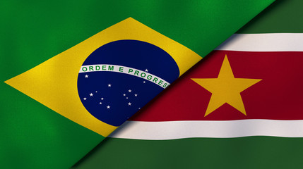 The flags of Brazil and Suriname. News, reportage, business background. 3d illustration