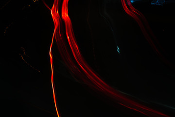 reds Light trail abstract blurred on a black background motion multicolored