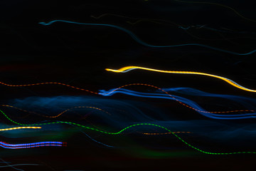 Light trail abstract blurred on a black background motion multicolored