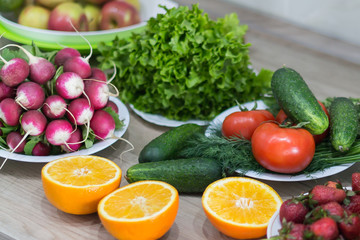 Fresh oranges, berries and vegetables.