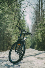 Fototapeta na wymiar mountain bike on a snow-covered path