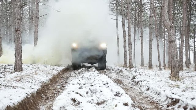 Airsoft. Through the smoke goes armored personnel carrier with soldiers