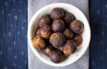 Black truffle chocolate energy protein sweet balls. Vegan cocoa dieting raw dessert.