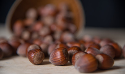 Macro photo Hazelnut nuts.Hazelnuts in a wooden bowl on rustic background