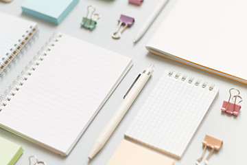 business training concept. notebooks on a blue background close-up clips and pens, stickers and stationery