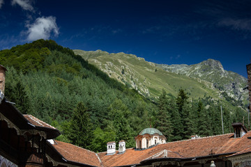 Green sharp peaks crowning a church