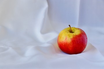 red apple on a wooden table