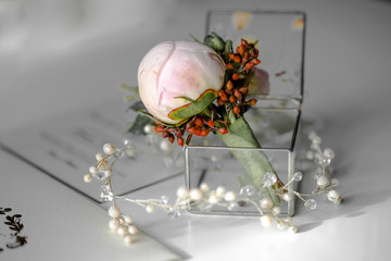 flowers and jewelry on the table
