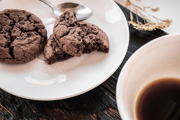 Chocolate cookies on a white plate macro photo