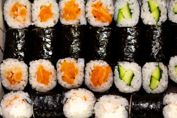 Thin rolls with salmon,cucumber,shrimp close up