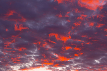 Beautiful red sunset sky. The sky, bright blue, orange colors of sunrise. Colorful dramatic sky