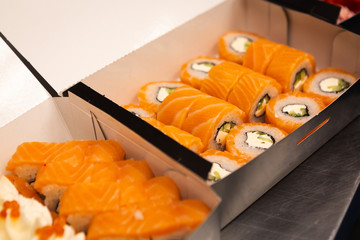 Philadelphia rolls set in boxes on the table