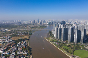 Top view aerial photo from flying drone of a Ho Chi Minh City with development buildings, transportation, energy power infrastructure