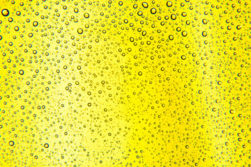the background is yellow with macro drops