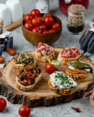 snacks set on wooden board _
