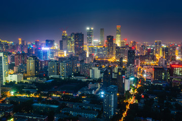 Obraz premium Futuristic city at night. Many high-rises and neon signs.