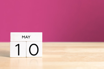 Mother's day with wooden block calendar on table and copy space.