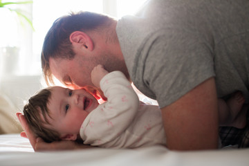 dad and baby loving play together