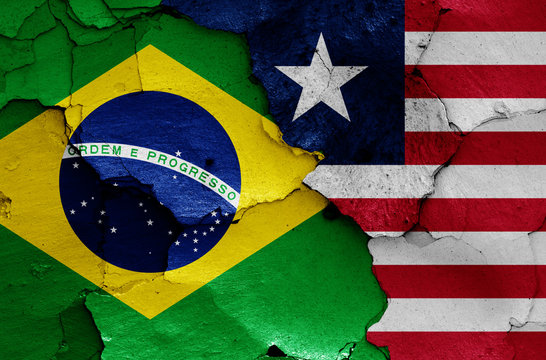 flags of Brazil and Liberia painted on cracked wall