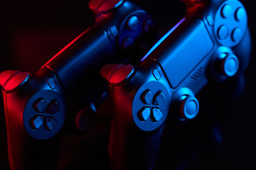  Sony Playstation 4 (PS4) DualShock 4 controller, videogame joystick or gamepad on a table. Close up studio shot. Game concept