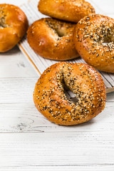 Freshly Baked Bagels Topped with Sesame Seeds, Poppyseeds, Garlic and Onion. Selective focus.