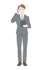 Obraz premium 電話 驚き ポーズ ビジネス スーツ タブレット 男性 全身