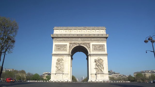 Paris street with the Arc de Triomphe in Paris, France.