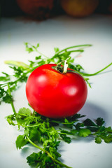 fresh tomatoes and parsley in a white background